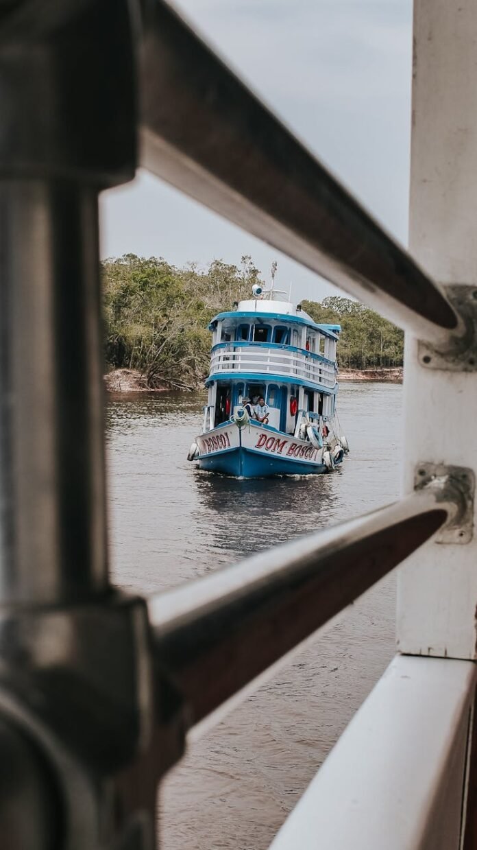 blue boat on the rio negro in manaus brazil