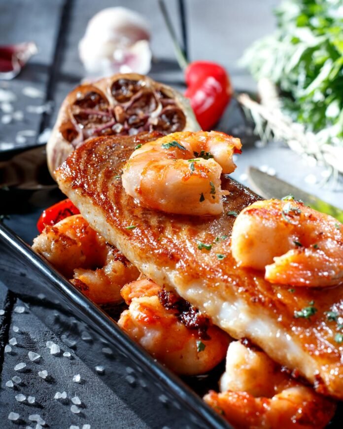 delicious seafood dish with grilled fish and shrimp
