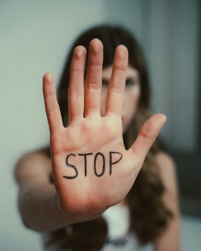 woman s hand with stop message communicates awareness