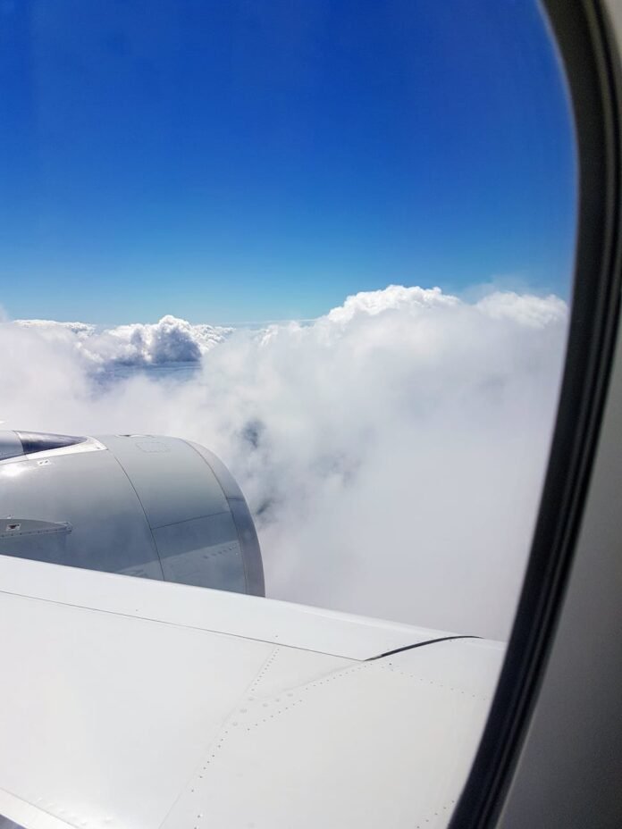airliner window showing clouds