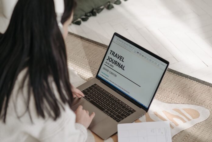 a person tying on the laptop