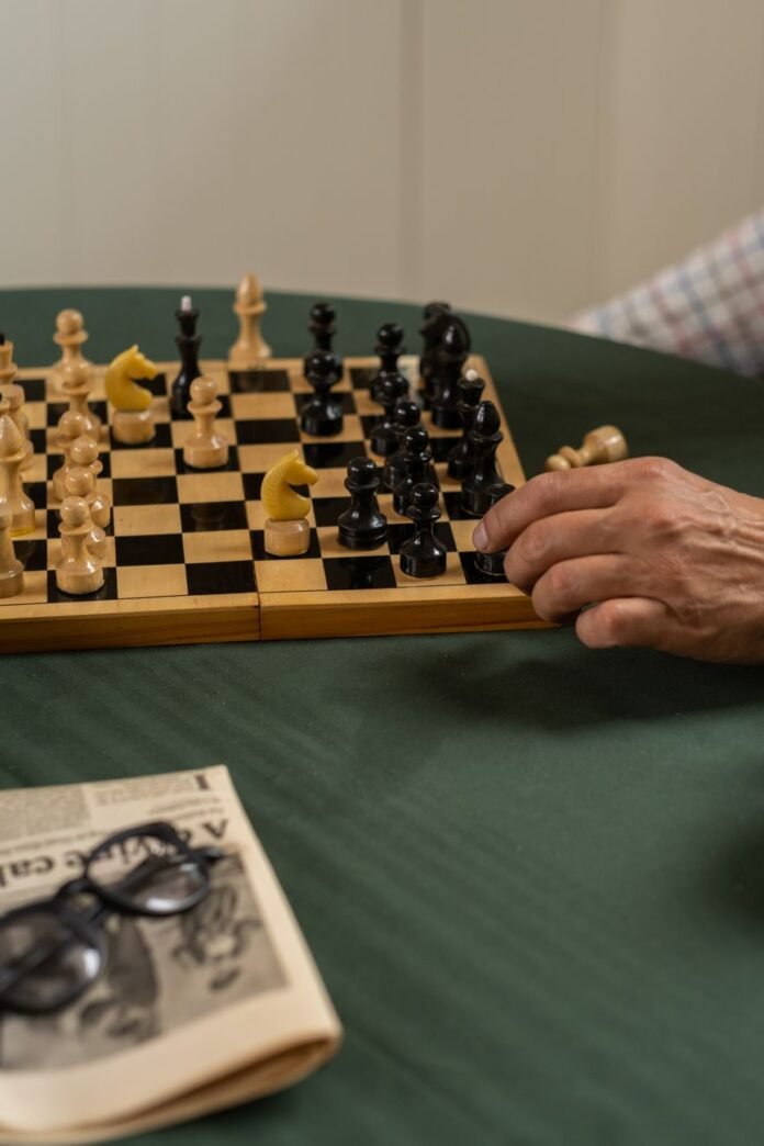 hand holding chess piece